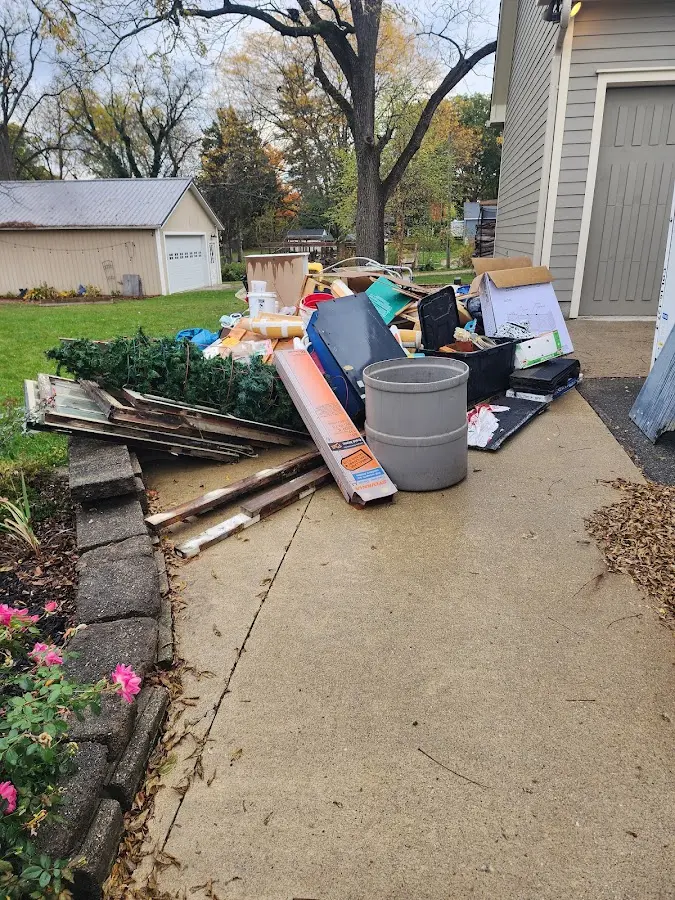 Dumpster being loaded with debris for Estate Cleanout Dumpster Rental in Upper Providence